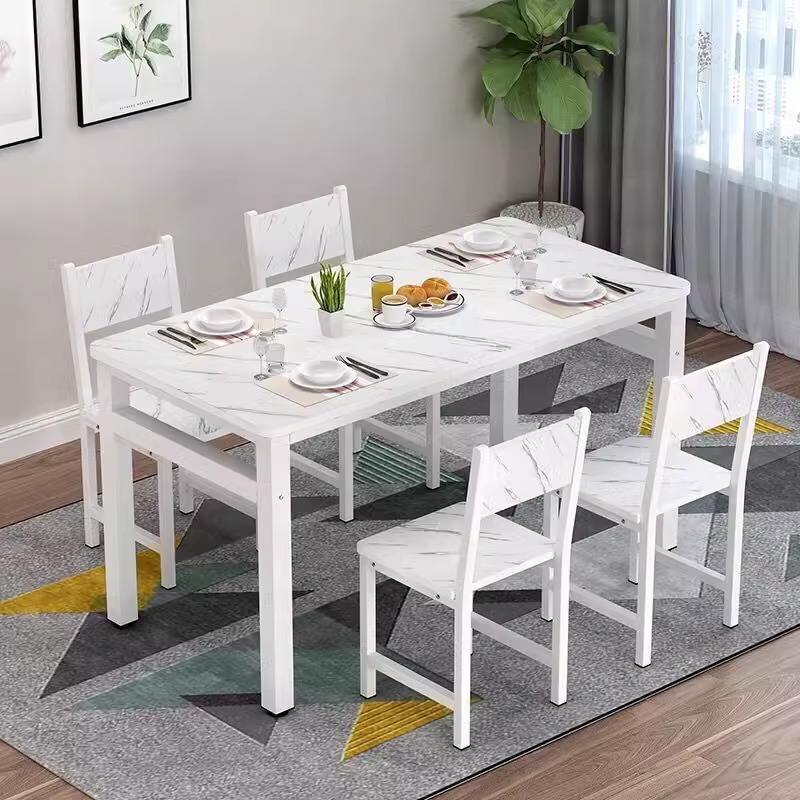 White marble-patterned table and four chairs