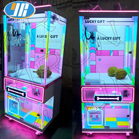 Machine de jeu à monnayeur de luxe, entièrement transparente, type grue à pinces pour poupées et bonbons, pour parcs et clubs de jeux roses