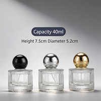 Vente en gros de flacons de parfum et de cosmétiques en verre cylindrique au design unique, 40 ml, avec pulvérisateur à pompe et décalcomanie à chaud