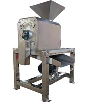 Machine industrielle automatique d'extraction de pulpe de fruits avec fonctions de décorticage et de dénoyautage pour la production de pulpe de fruits