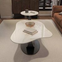 Table de salon en forme de roche blanche, petite maison simple, lumière irrégulière, table basse blanche de luxe