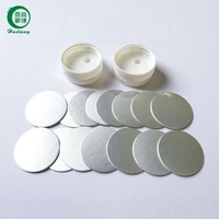 Voedselverpakkingen met inductiefolie verzegeling, kartonnen achterkant en aluminiumfolie voering.