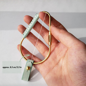 Cross-border PU <b>leather</b> brass carabiner <b>keychain</b>, simple retro pacifier stud key pendant, car <b>keychain</b> - Product Image 2