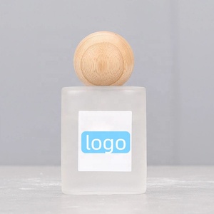 ขวดสเปรย์แก้วฝ้าก้นหนา 1 ออนซ์ พร้อมหัวปั๊มสำหรับเครื่องสำอาง ขวดสเปรย์น้ำหอมแบบละอองละเอียด ฝาไม้ - Product Image 1