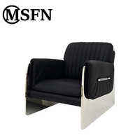 Fauteuil lounge en cuir véritable Bauhaus, dossier plissé noir, accoudoirs en acier inoxydable poli, fauteuil moderne pour salon, lecture