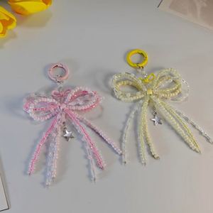 Porte-clés artisanal léger et tendance en acrylique en forme de nœud, avec ornement cœur en alliage de zinc et perles décoratives pour sacs et téléphones - Product Image 2