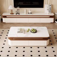 Table basse élégante bicolore avec plateau en pierre frittée et tiroirs à fermeture douce