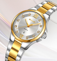Montre SKMEI pour Femme Cadran Chiffres Romains Affichage de la Date Bracelet Métal Bicolore Décoration en Cristal