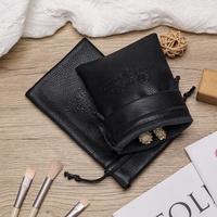 Pochette à bijoux en cuir PU noir en gros Pochette à cordon pour clés Petits sacs à jouets Logo personnalisé Gaufrage