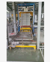 Le palettiseur de blocs M1200, une machine d'empilage et d'emballage entièrement automatique, convient à l'emballage de différents types de briques de ciment.