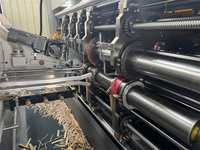 Mesin Pengemasan Kotak Karton Bergelombang dengan Fungsi Pencetakan, Pembuatan Slot, Pemotongan Die-Cutting, Pelipatan, Perekatan, dan Pengikatan Tali