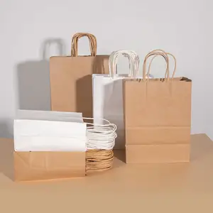 Fornitore di fabbrica riciclabile manico marrone kraft sacchetto di carta biodegradabile abbigliamento imballaggio artigianale shopping sacchetto di carta con loghi