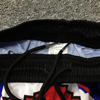 Short de basketball personnalisé à la mode pour hommes avec impression par sublimation
