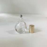 Vente en gros 10ml bouteille en verre de rouleau en forme de boule ronde transparente avec bouchon en or brillant