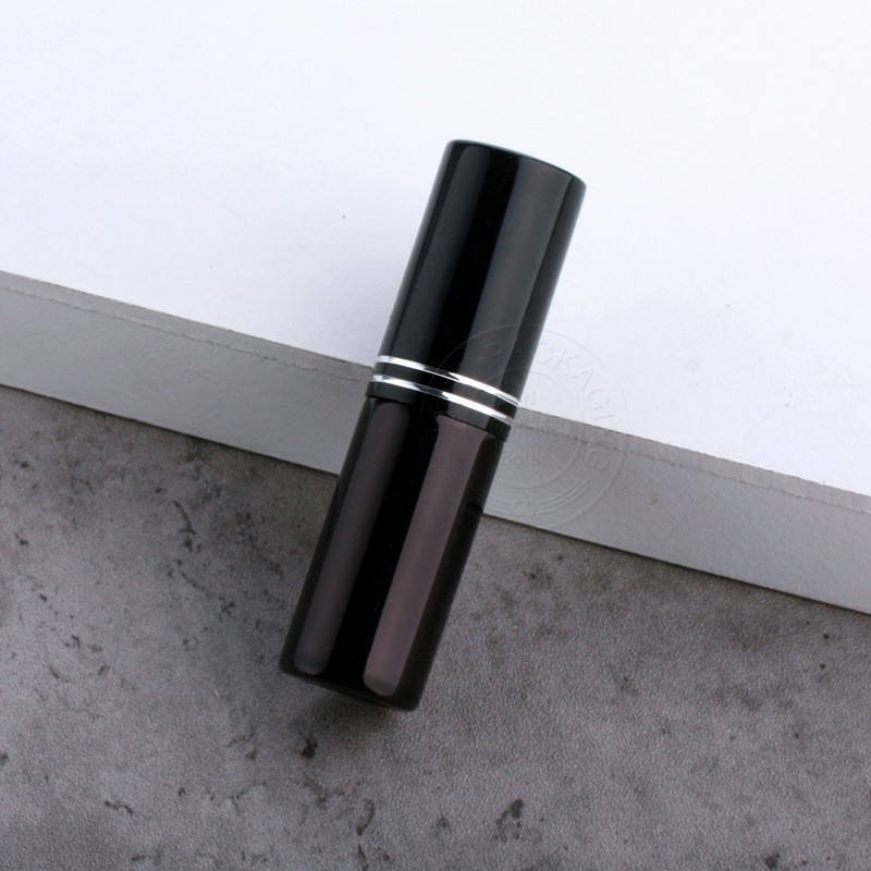 Black bottle with double line cap