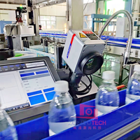 Marqueur laser CO2 volant 30W 40W pour la gravure de codes de date sur les bouteilles en plastique