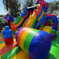 Château gonflable commercial en PVC avec toboggan et blocs de construction Lego, personnalisable en couleur et logo