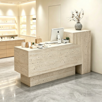 Comptoir de réception minimaliste moderne, petit bureau d'accueil, boutique de vêtements pour femmes, salon de beauté, salon de coiffure, comptoir de caisse aspect pierre