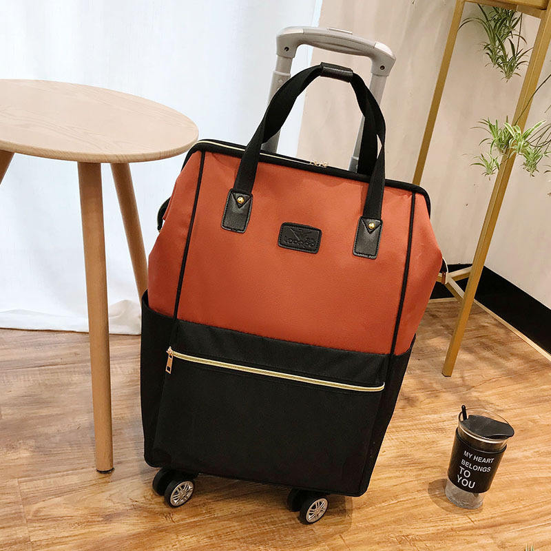 Orange swivel wheel single trolley bag