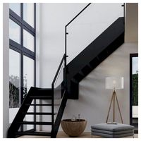 Escalier flottant moderne Prima avec poutre en acier au carbone et garde-corps en verre pour villa