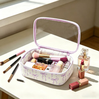 Trousse de Maquillage Transparente Grande Capacité en PVC Imprimé Nœud Papillon Coquette – Organisateur de Maquillage et Trousse de Toilette de Voyage