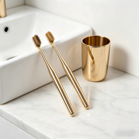 Brosse à dents souple plaquée or avec logo OEM et poils PBT pour le blanchiment des dents, usage adulte, usage domestique, outil de soin buccal manuel