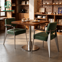 Chaise en cuir rembourrée, base en acier inoxydable et bois de noyer, mobilier de café commercial Ron Group, table de restaurant bistro.