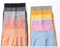 Leggings de sport pour femmes à taille haute élastique, respirants, à séchage rapide, sans couture, à motif uni, avec logo personnalisé et effet scrunch fessier