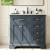 Meuble-lavabo de salle de bain en marbre, style américain traditionnel, avec vasque simple, armoire à panneaux surélevés laquée bleu foncé, dimensions personnalisées