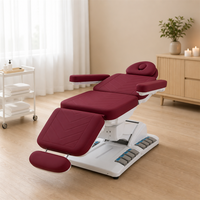Table de traitement électrique rouge et blanche avec commande par pédale, repose-jambes 3 sections, base métallique, hauteur réglable, pour massage et salon de beauté