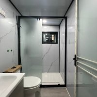 Maison préfabriquée extensible en acier avec fenêtres, idéale pour usage commercial (centre commercial) ou bureau à domicile, fabriquée à partir de panneaux sandwich.