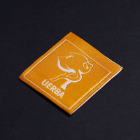 Étiquette tissée jacquard personnalisée de luxe, logo en caoutchouc 3D souple, marque personnalisée pour la décoration de costumes et de vêtements
