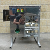 Machine semi-automatique pour l'élimination des coques de noix de coco, le décorticage et le pelage des noix dures