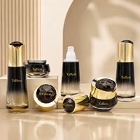 Ensemble de flacons et pots cosmétiques en verre noir dégradé de luxe avec bouchon doré brillant pour sérum et crème de soin