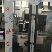 Machine d'étiquetage automatique à manchon rétractable pour bouteilles, canettes, barils, emballages en verre et en plastique