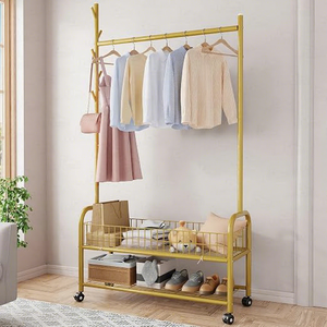 Modern Yellow Metal <b>Clothing</b> <b>Rack</b> With Double Tier Storage Shelf And Wheels For Living Room Use - Product Image 1