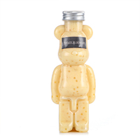 Vente en gros en stock – Bouteille PET en forme d'ours de 350 ml à 700 ml (14 oz à 22 oz) pour champagne et jus, avec couvercle en aluminium