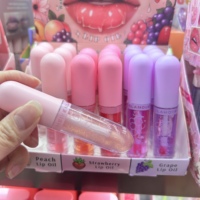 Vente en gros Huile liquide pour les lèvres à la fraise 6 couleurs changeantes Récipient végétalien Rouge à lèvres hydratant Brillant à lèvres Maquillage de fille en vrac