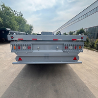 Semi-remorque à plateforme à 3 essieux, conception robuste pour le transport de conteneurs, de machines et de matériaux de construction