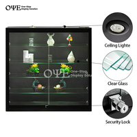 Vitrine murale éclairée par LED avec étagères en verre trempé multicouches
