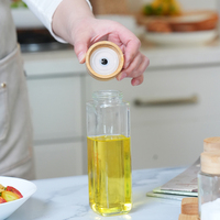 Vente en gros bouteille distributeur d'huile d'olive et de vinaigre en verre de luxe de qualité support en bois avec bec en métal et bambou