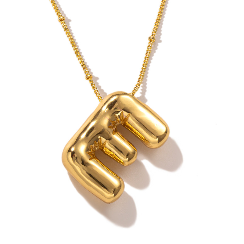 Gold E necklace