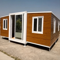 Maison préfabriquée mobile à structure en acier extensible avec panneaux sandwich, design moderne de 20 pieds pour magasin et usage extérieur