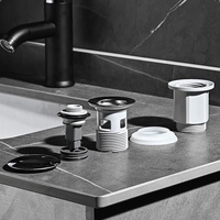 Évier de salle de bain moderne avec drain 90 mm en plastique et laiton poli, design pop-up