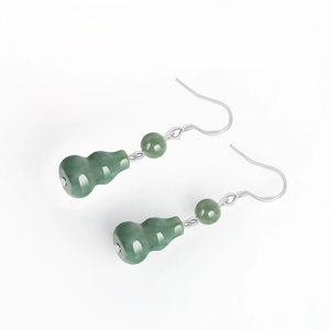 Natural <b>emerald</b> green bean-shaped hoop earrings made of jade bean-shaped stone. Set with S925 silver - Product Image 3