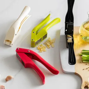 Multifunctional Plastic Garlic Press and Peeler 2 in 1 Manual Kitchen <b>Tool</b> with Wide Handle and Double Slot Chopper Mincer - Product Image 1