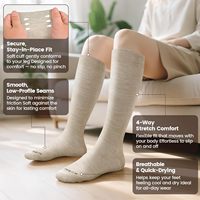 Chaussettes de compression personnalisées tricotées respirantes antidérapantes épaisses ODM pour jeunes, avec revers inférieur, soutien gradué, hauteur genou, pour le sport en hiver