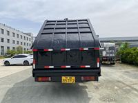 Camion benne compacteuse de déchets robuste de 20 mètres cubes avec double pompe, réservoir d'égouts et grande benne arrière à chargement par tombée
