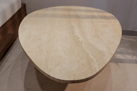 MEUBLES JIAMEIJIA |   Table basse en forme de galet effet travertin avec base sur piédestal