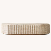 Table basse RH BYRON REEDED STONE, plateau en marbre travertin naturel, design à nervures verticales, base en piédestal moderne et luxueuse, salon